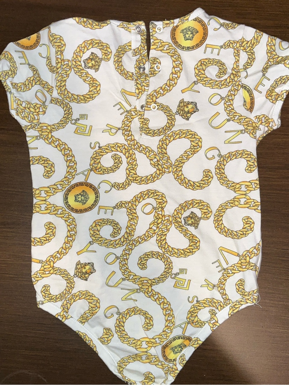 Versace White Onesie with Gold Chain Print